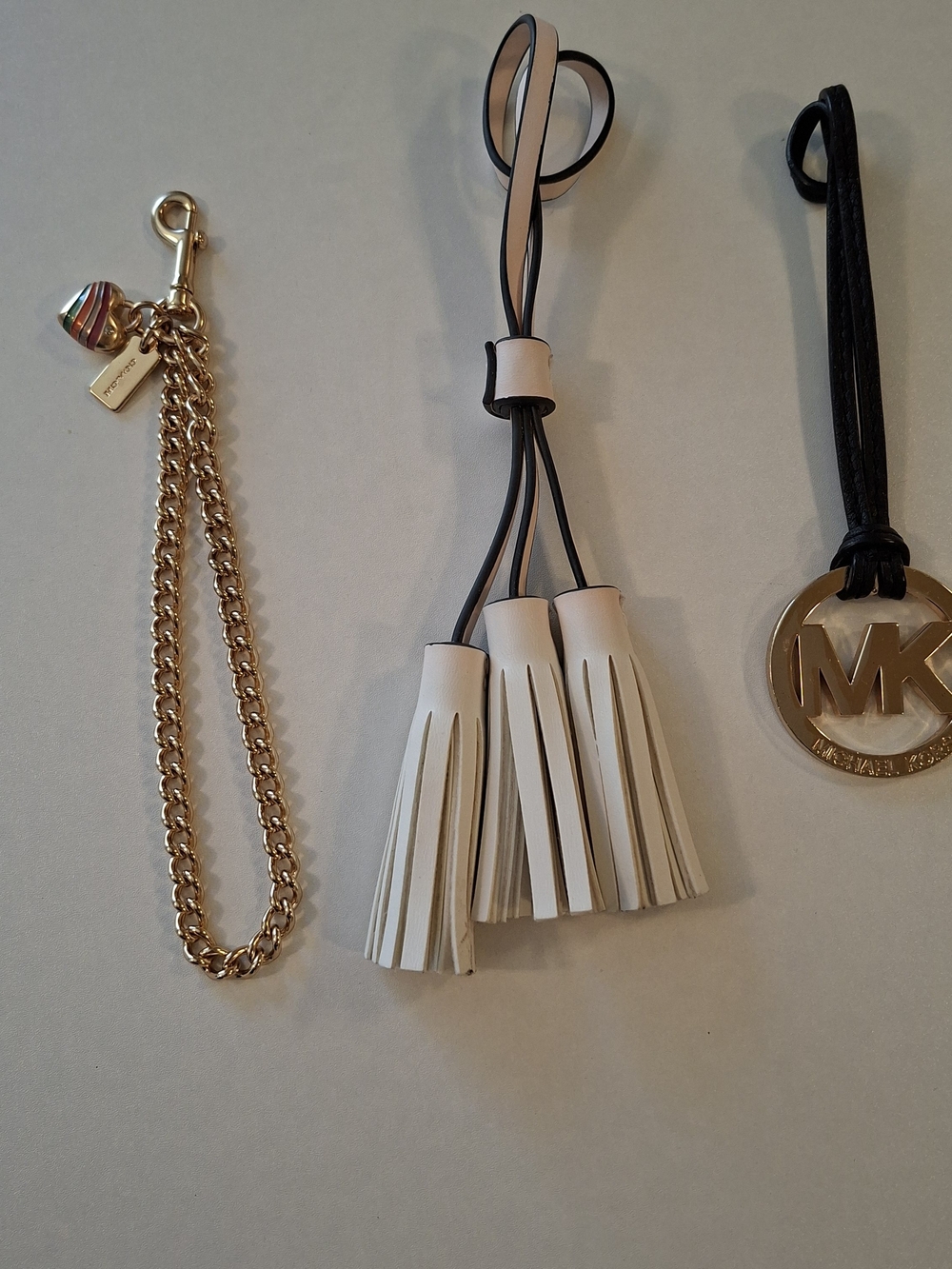 3 PURSE FOBS COACH MICAEL KORS AND LEATHER TASSLES